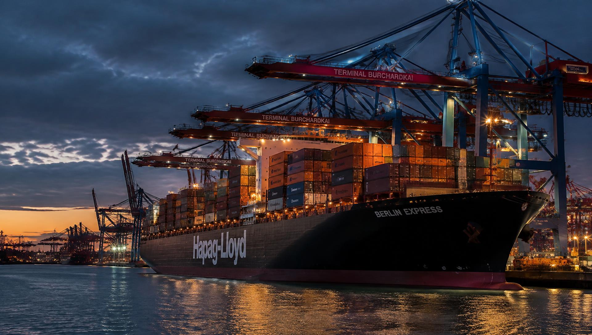 Container vessel at a port being loaded by gantry cranes